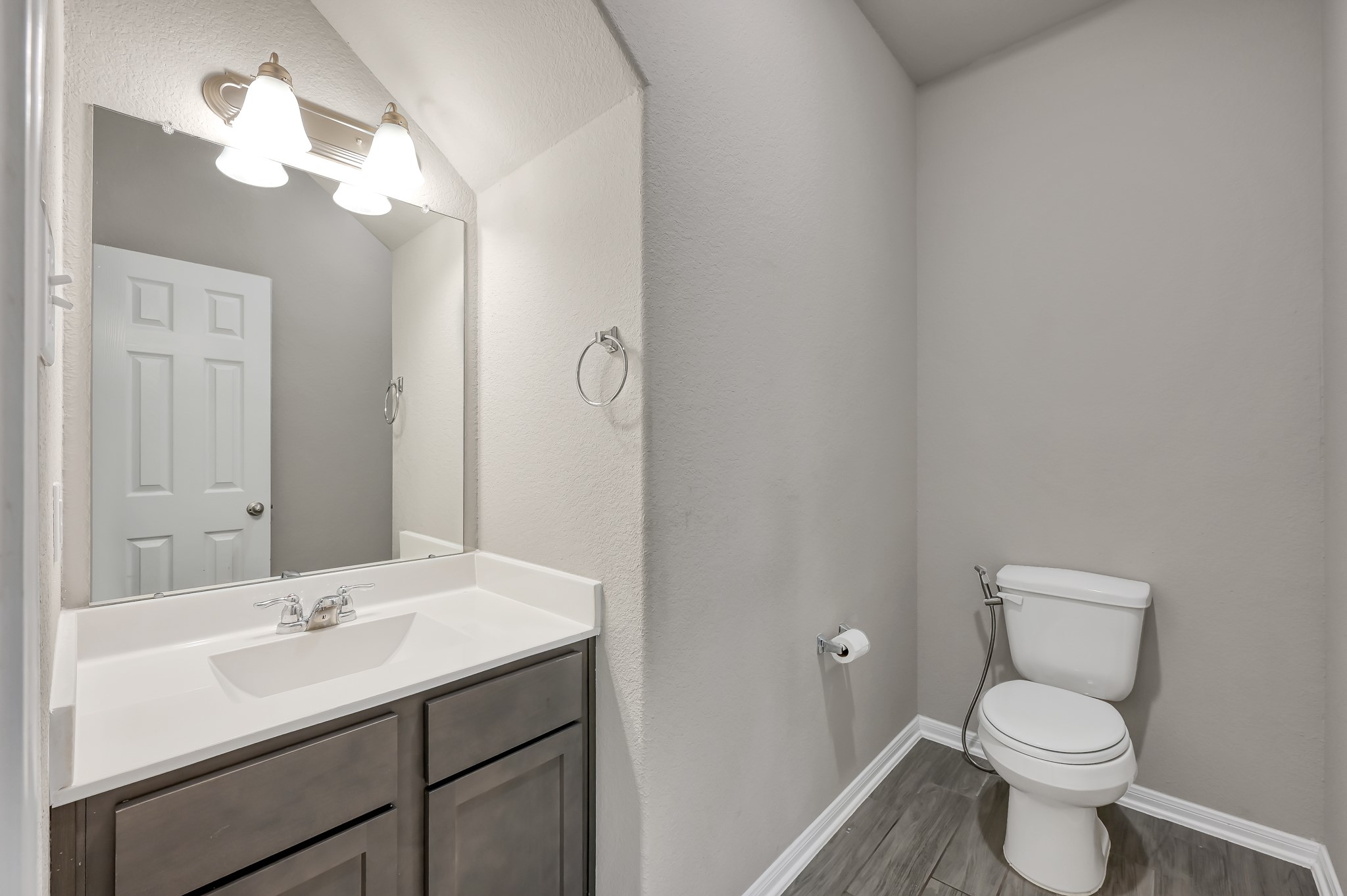 29211 Sequoia Tree Trail Spring, TX 77386 - Photo 11 of 32 a bathroom with a toilet sink and mirror