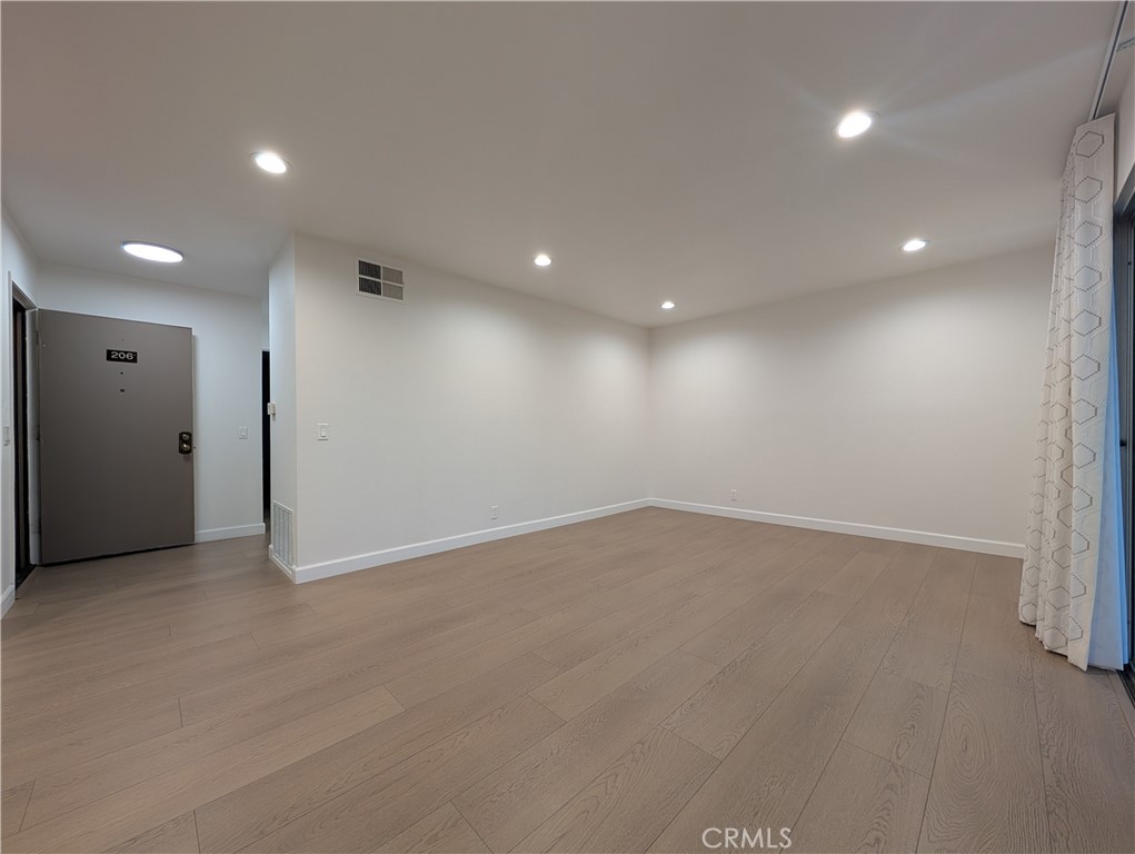 17052 Colima Road, Unit 206 Hacienda Heights, CA 91745 - Photo 5 of 15 an empty room with a empty space and windows