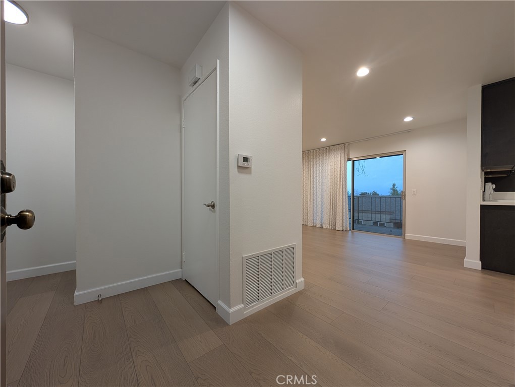 17052 Colima Road, Unit 206 Hacienda Heights, CA 91745 - Photo 6 of 15 a view of an empty room with kitchen and a window