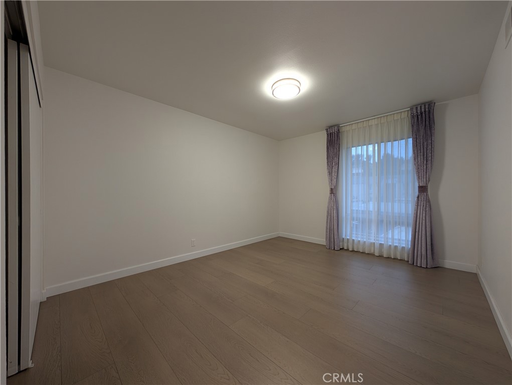 17052 Colima Road, Unit 206 Hacienda Heights, CA 91745 - Photo 8 of 15 an empty room with a empty space and windows