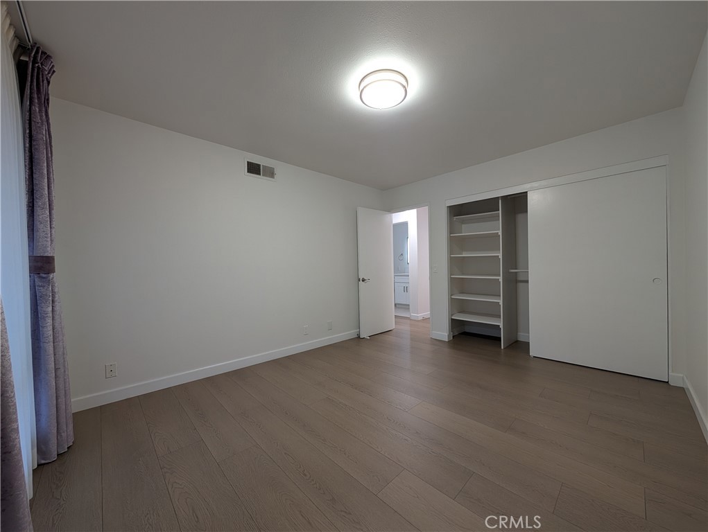 17052 Colima Road, Unit 206 Hacienda Heights, CA 91745 - Photo 9 of 15 wooden floor in an empty room