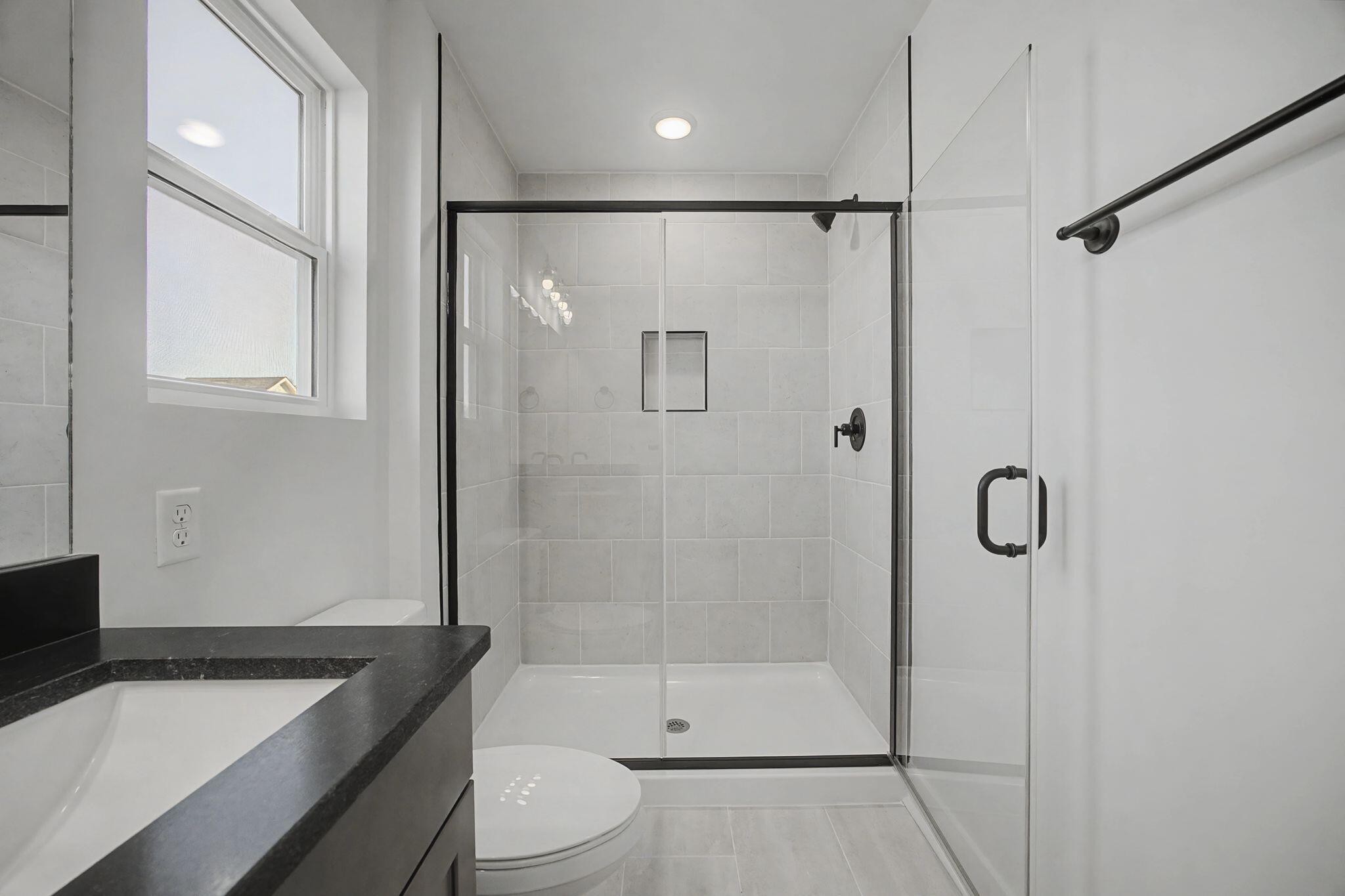 1616 Cotton Way Chattanooga, TN 37404 - Photo 26 of 38 a bathroom with a granite countertop sink a toilet and shower