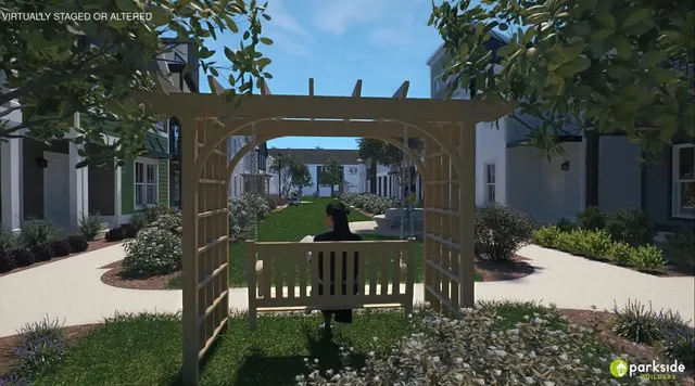 a view of a house with a yard and plants