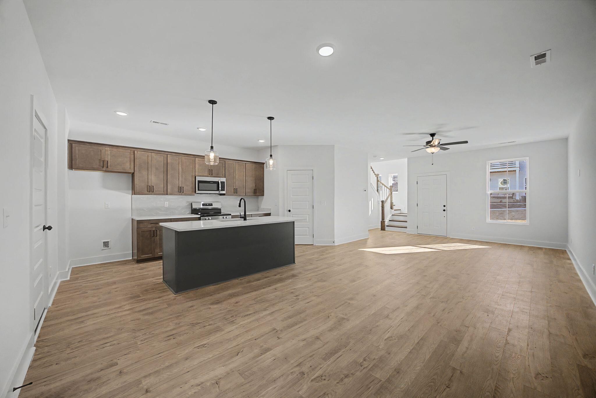 1616 Cotton Way Chattanooga, TN 37404 - Photo 6 of 38 a large kitchen with kitchen island a sink stainless steel appliances and cabinets