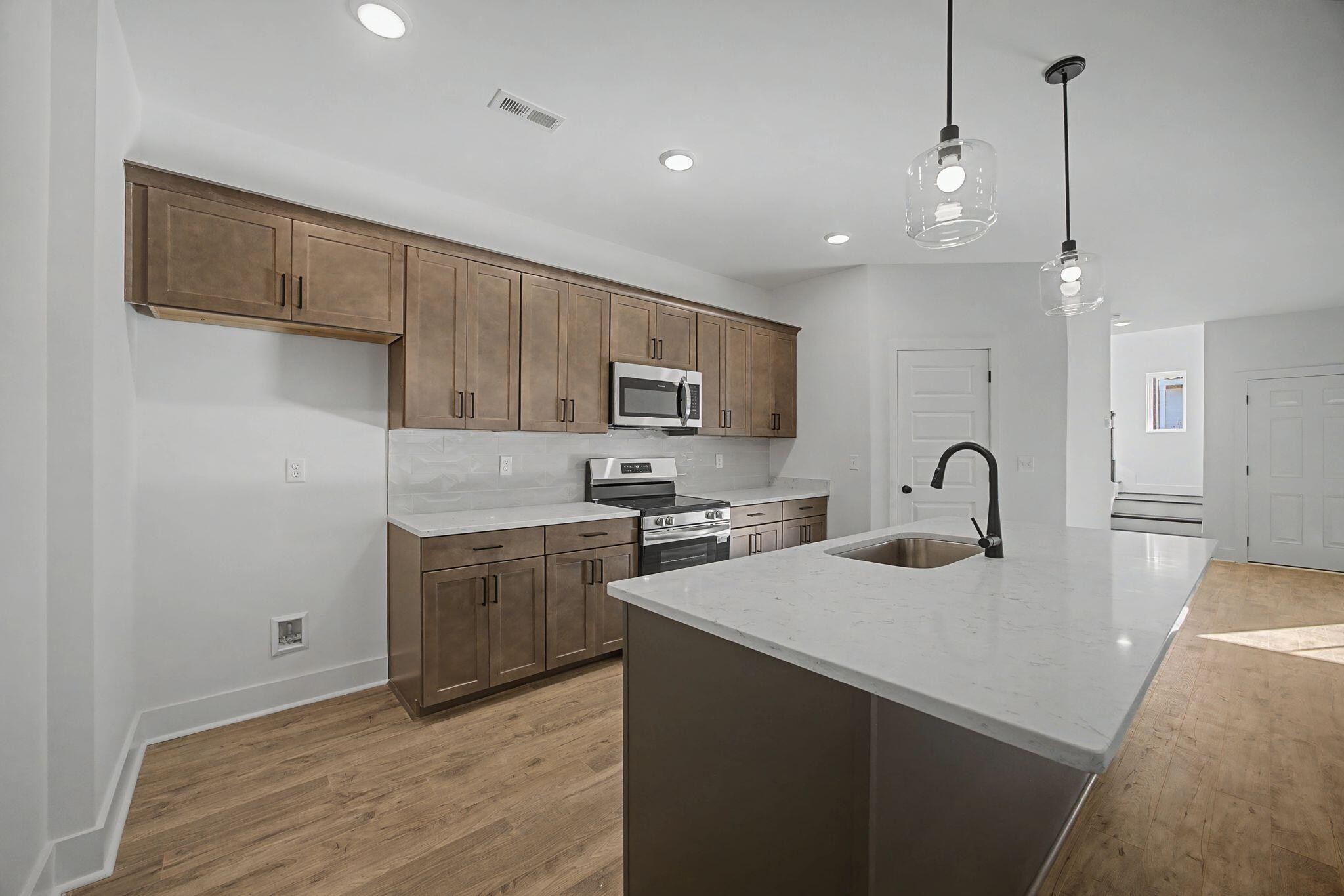 1616 Cotton Way Chattanooga, TN 37404 - Photo 8 of 38 a kitchen with a sink stainless steel appliances and cabinets