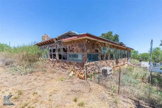 a view of a garden with a building in the background