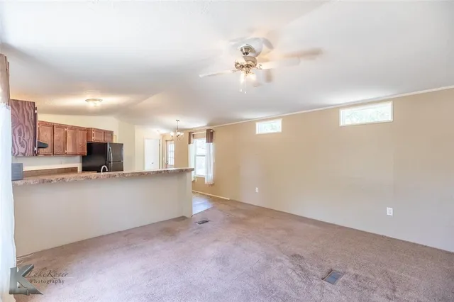 a view of a kitchen with furniture and a window