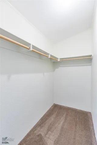 a bathroom with a bathtub a sink and a mirror