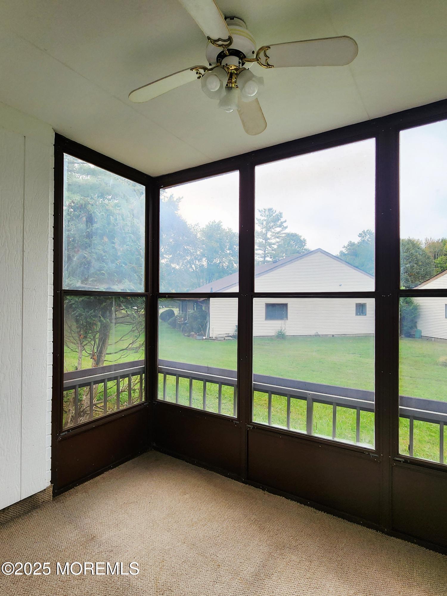 78 Overlook Way, Unit C Manalapan, NJ 07726 - Photo 13 of 15 a view of an empty room with a window