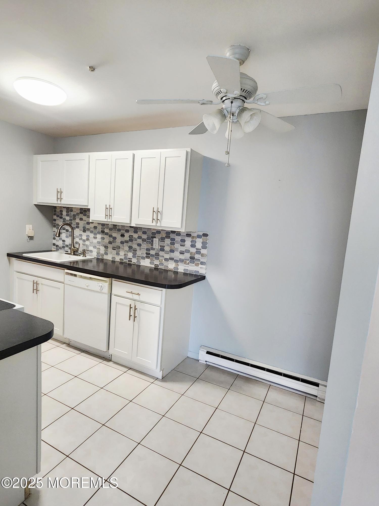 78 Overlook Way, Unit C Manalapan, NJ 07726 - Photo 2 of 15 a kitchen with stainless steel appliances a cabinets and sink