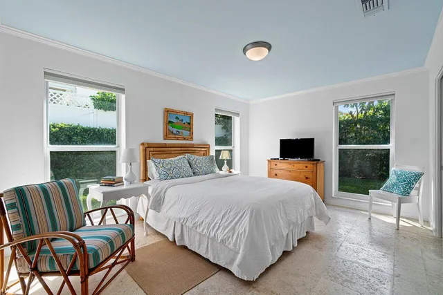 a bedroom with a bed and a view of bedroom