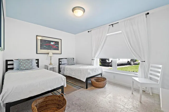 a bedroom with a bed and a table