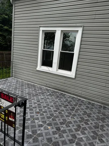 a view of a house with a door and a chair