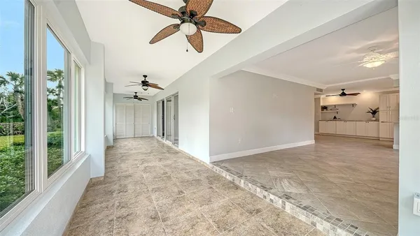 a large kitchen with stainless steel appliances granite countertop a stove a sink and a refrigerator