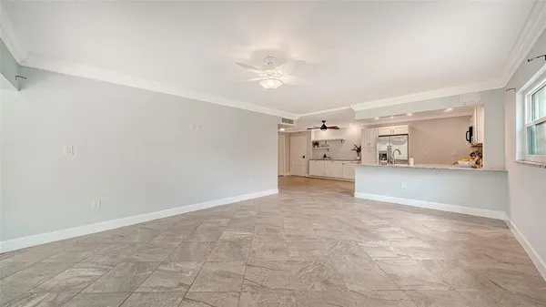 a very nice looking room with a ceiling fan