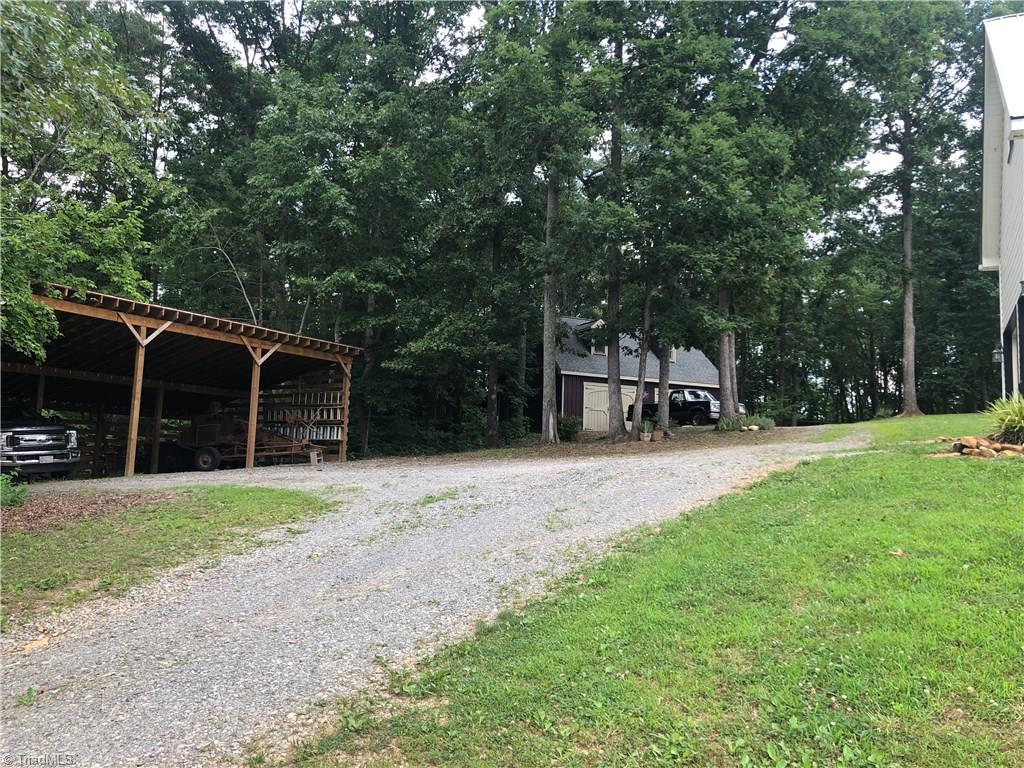 1127 Wood Stack Trail Road Westfield, NC 27053 - Photo 19 of 30 3 Car detached parking shed and 2 bay work shop with quest quarters are located next to the home. Work shop has shed on the back.
