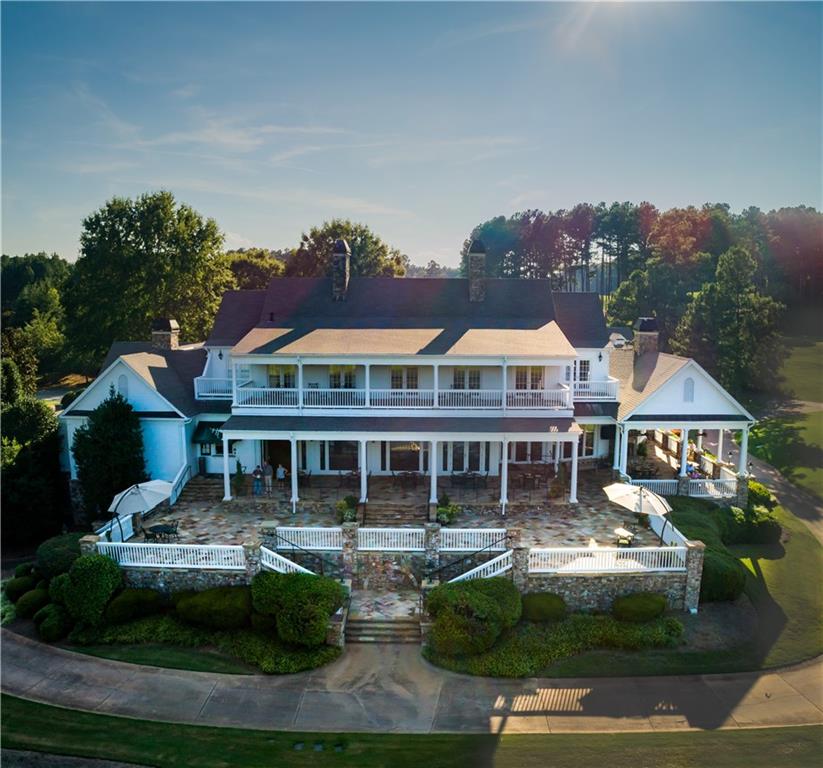 130 Talon Way Canton, GA 30115 - Photo 4 of 7 a front view of a residential apartment building with a yard
