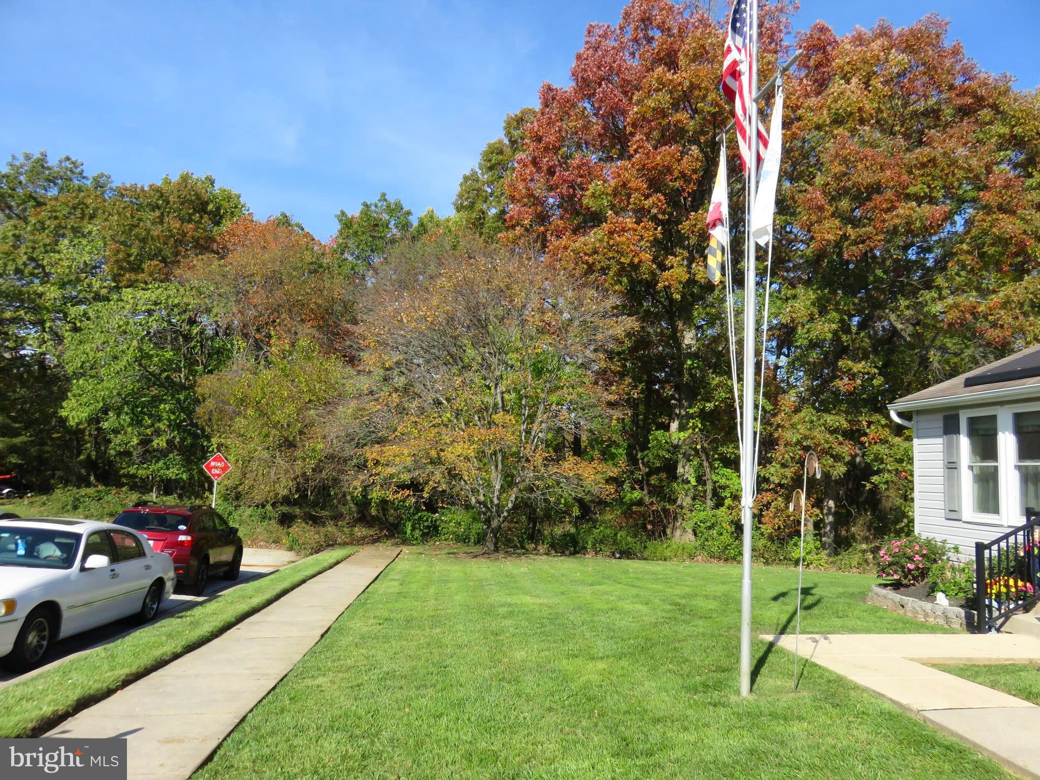 6823 Fordcrest Road Baltimore, MD 21237 - Photo 29 of 32 a view of yard with seating area