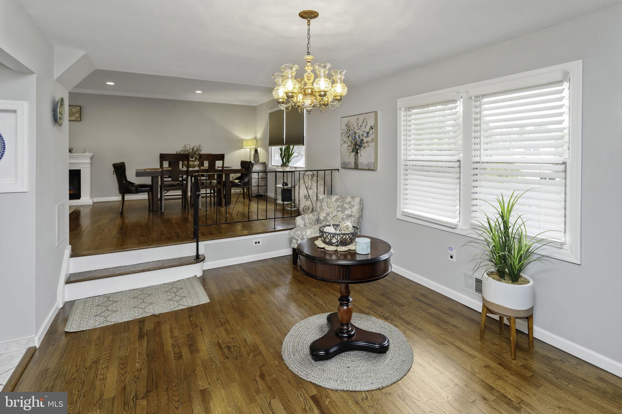 31 Wolfpack Road Hamilton, NJ 08619 - Photo 12 of 36 a living room with furniture and a chandelier
