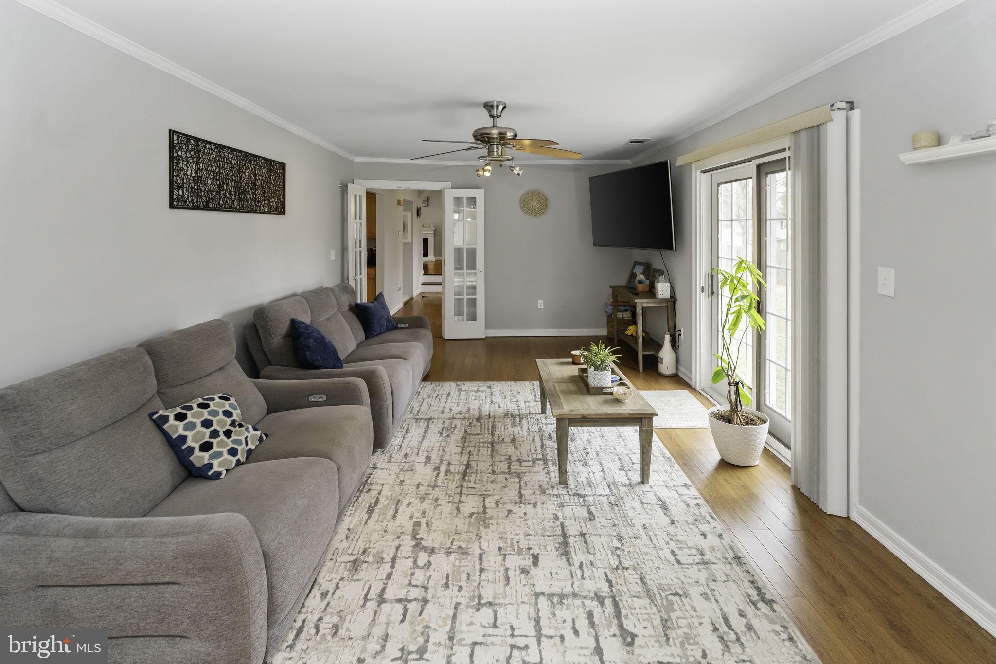 31 Wolfpack Road Hamilton, NJ 08619 - Photo 14 of 36 a living room with furniture and a chandelier