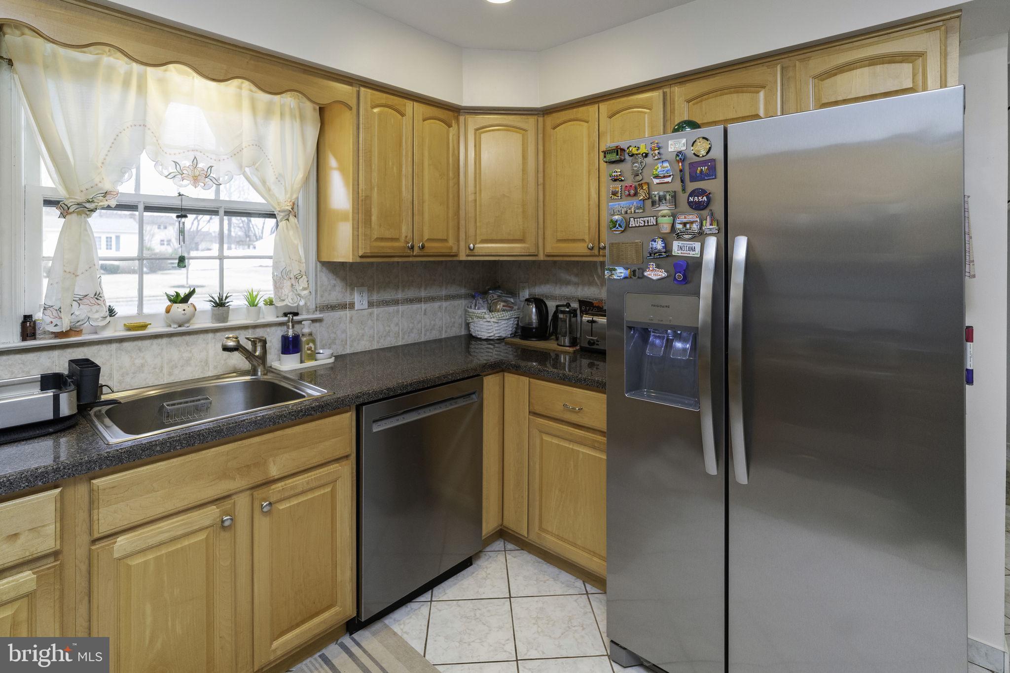 31 Wolfpack Road Hamilton, NJ 08619 - Photo 19 of 36 a kitchen with a refrigerator and a sink