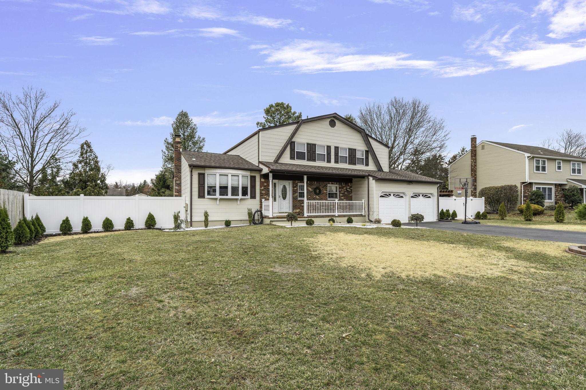 31 Wolfpack Road Hamilton, NJ 08619 - Photo 2 of 36 a view of a big house with a big yard and large trees