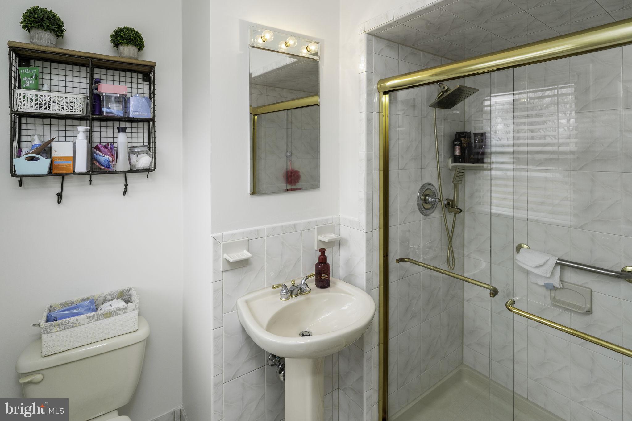 31 Wolfpack Road Hamilton, NJ 08619 - Photo 23 of 36 a bathroom with a sink toilet and shower