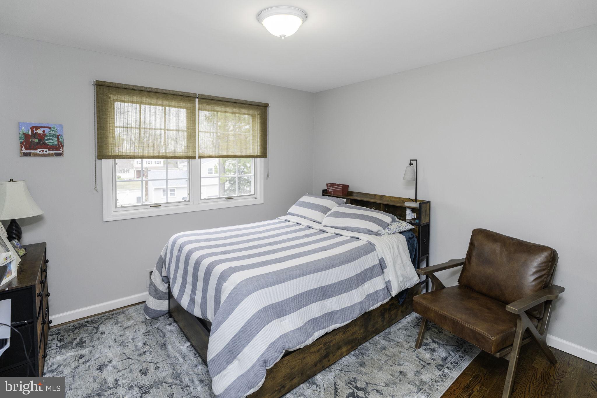 31 Wolfpack Road Hamilton, NJ 08619 - Photo 25 of 36 a bed sitting in a bedroom next to a window