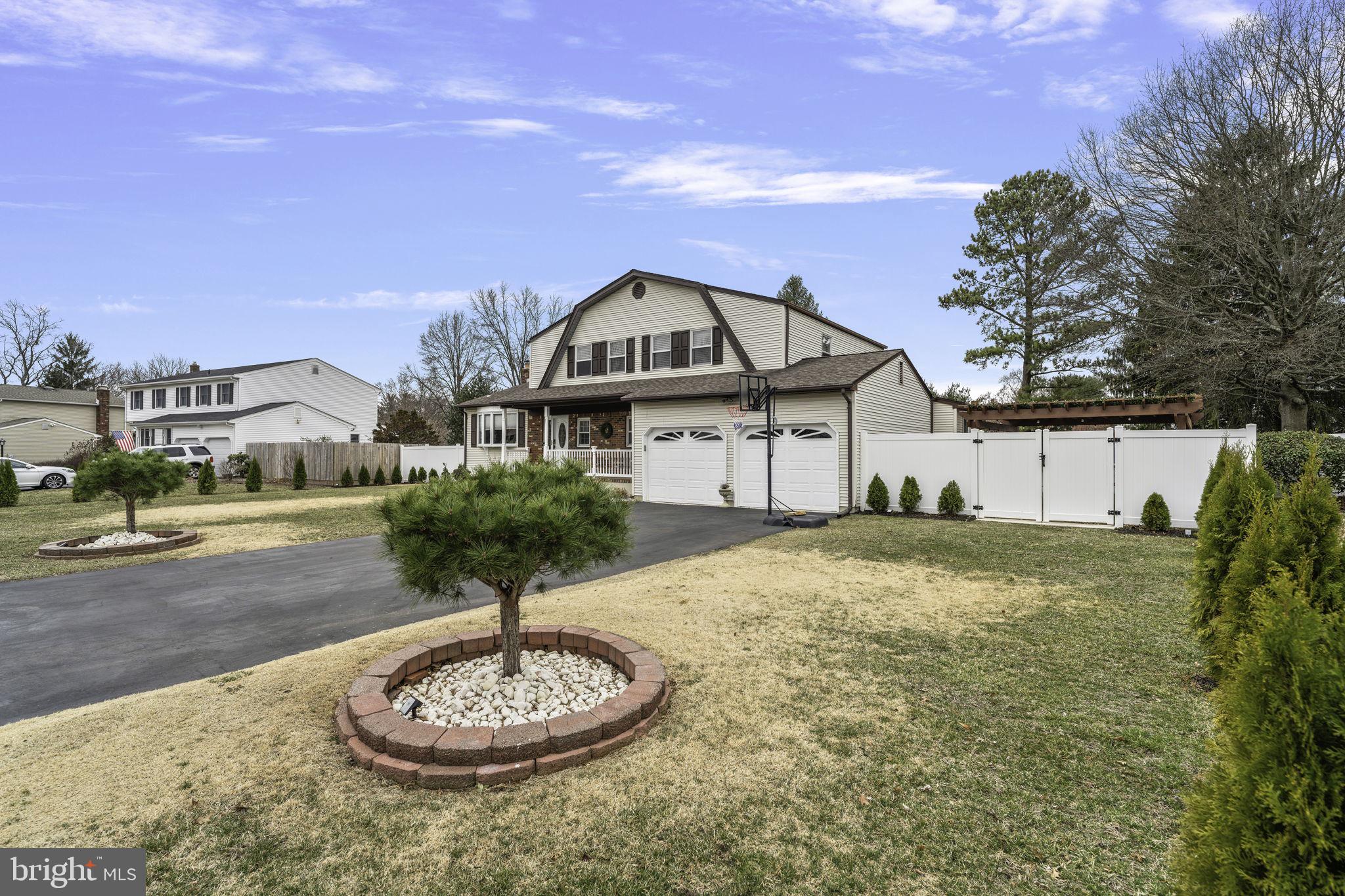 31 Wolfpack Road Hamilton, NJ 08619 - Photo 4 of 36 a house with a big yard and a large tree in it