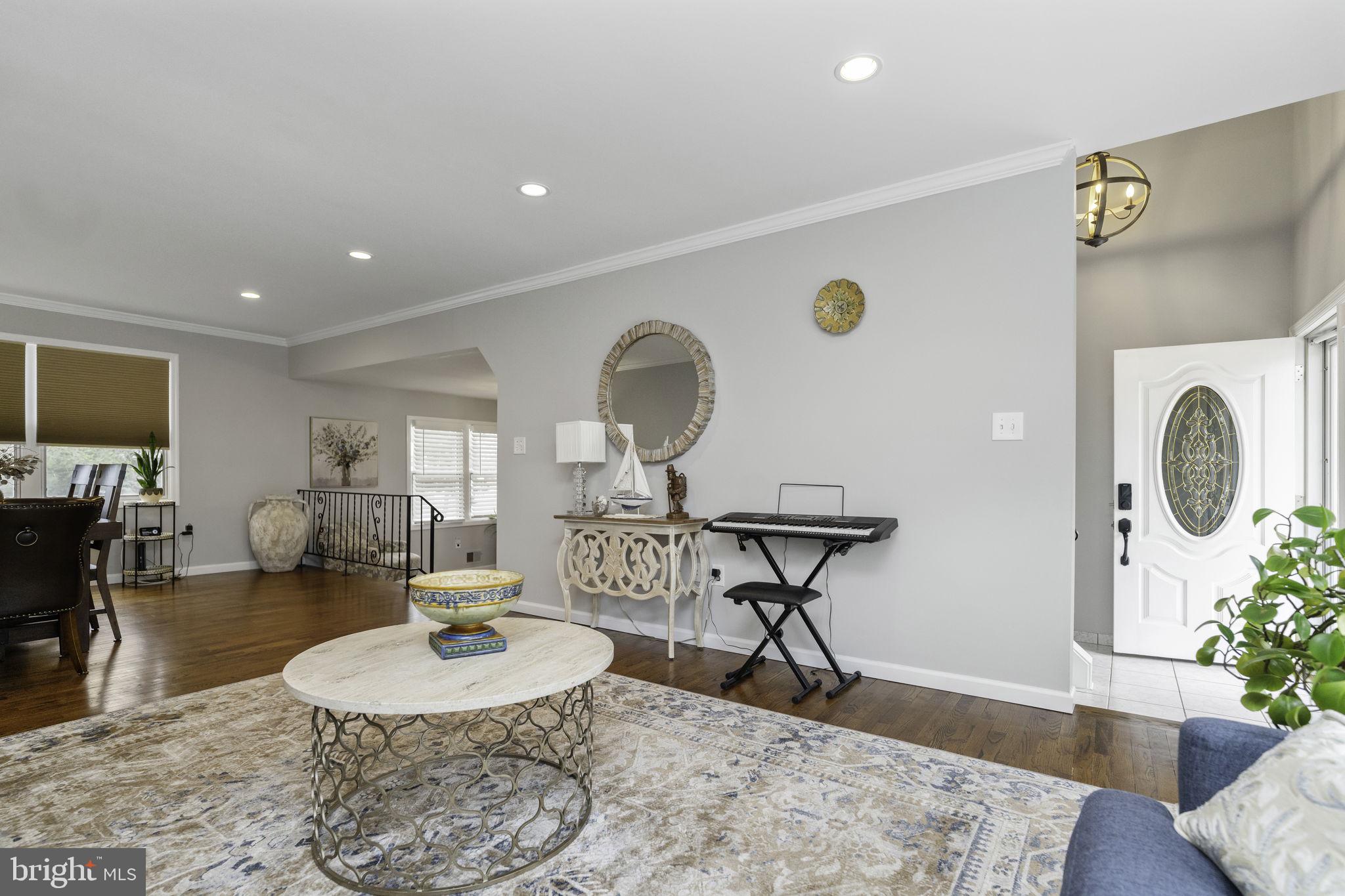 31 Wolfpack Road Hamilton, NJ 08619 - Photo 6 of 36 a living room with furniture a flat screen tv and a table