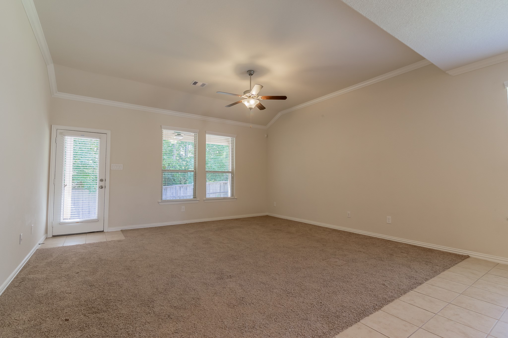 5 Iris Arbor Court Conroe, TX 77301 - Photo 17 of 35 wooden floor in an empty room with a window