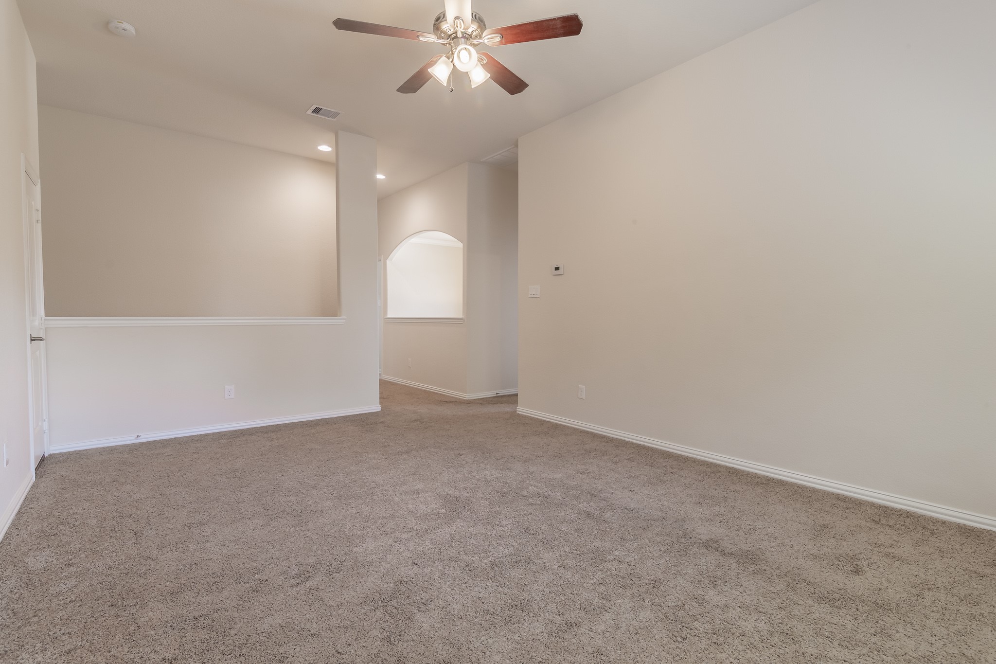 5 Iris Arbor Court Conroe, TX 77301 - Photo 28 of 35 an empty room with a fan & a window