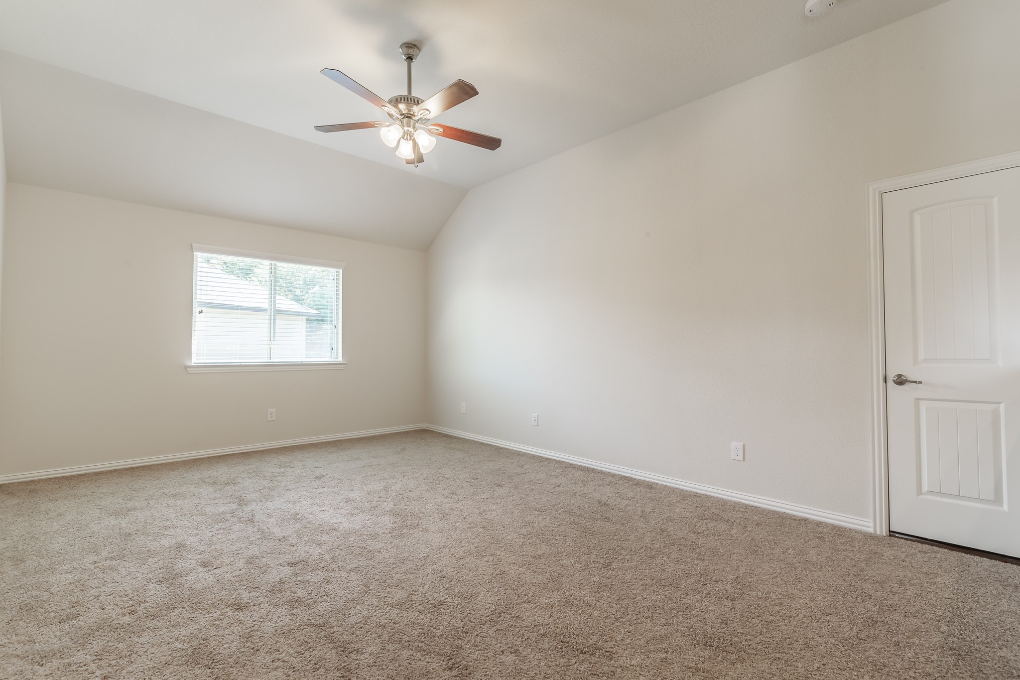 5 Iris Arbor Court Conroe, TX 77301 - Photo 29 of 35 an empty room with windows and fan