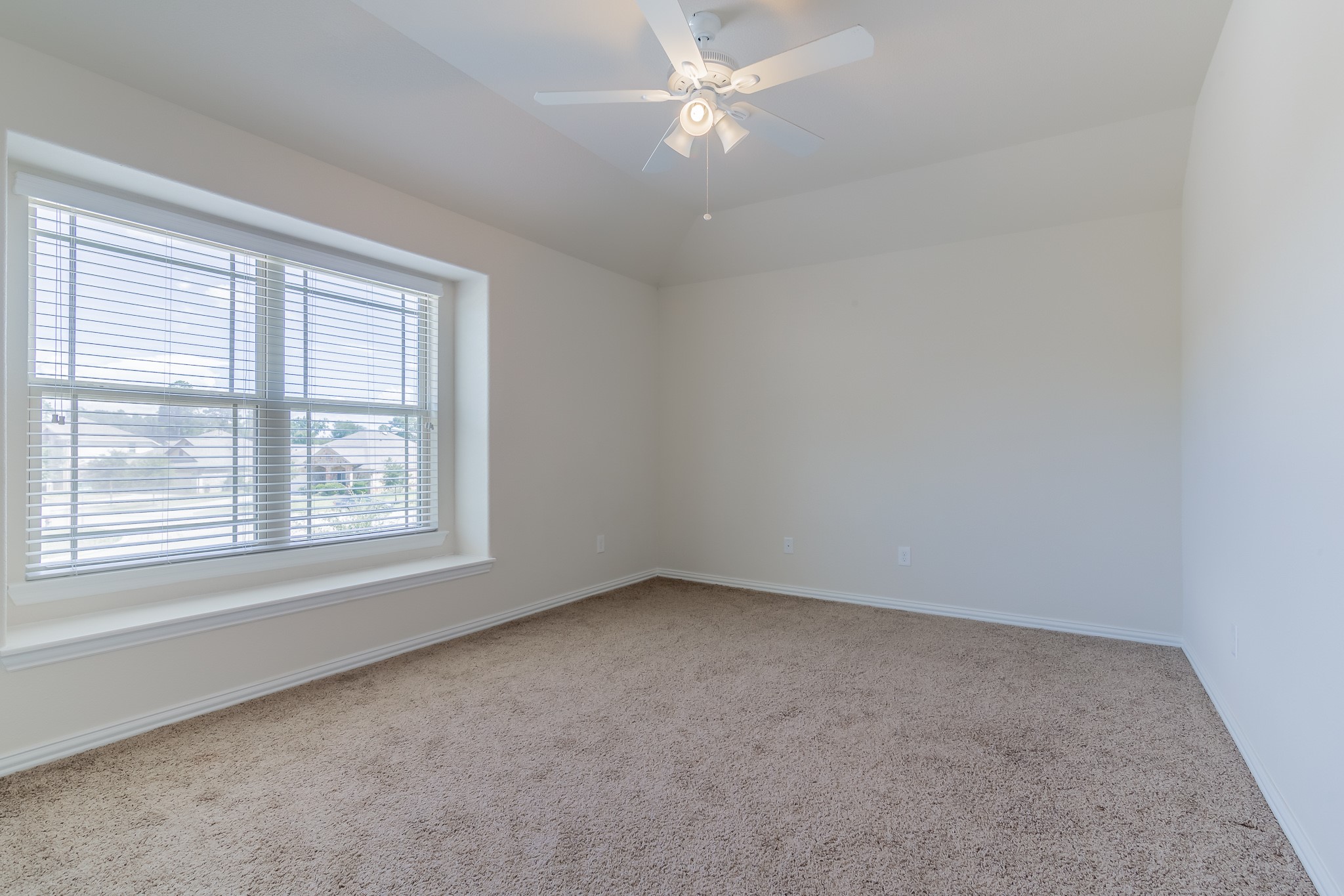 5 Iris Arbor Court Conroe, TX 77301 - Photo 32 of 35 an empty room with a window
