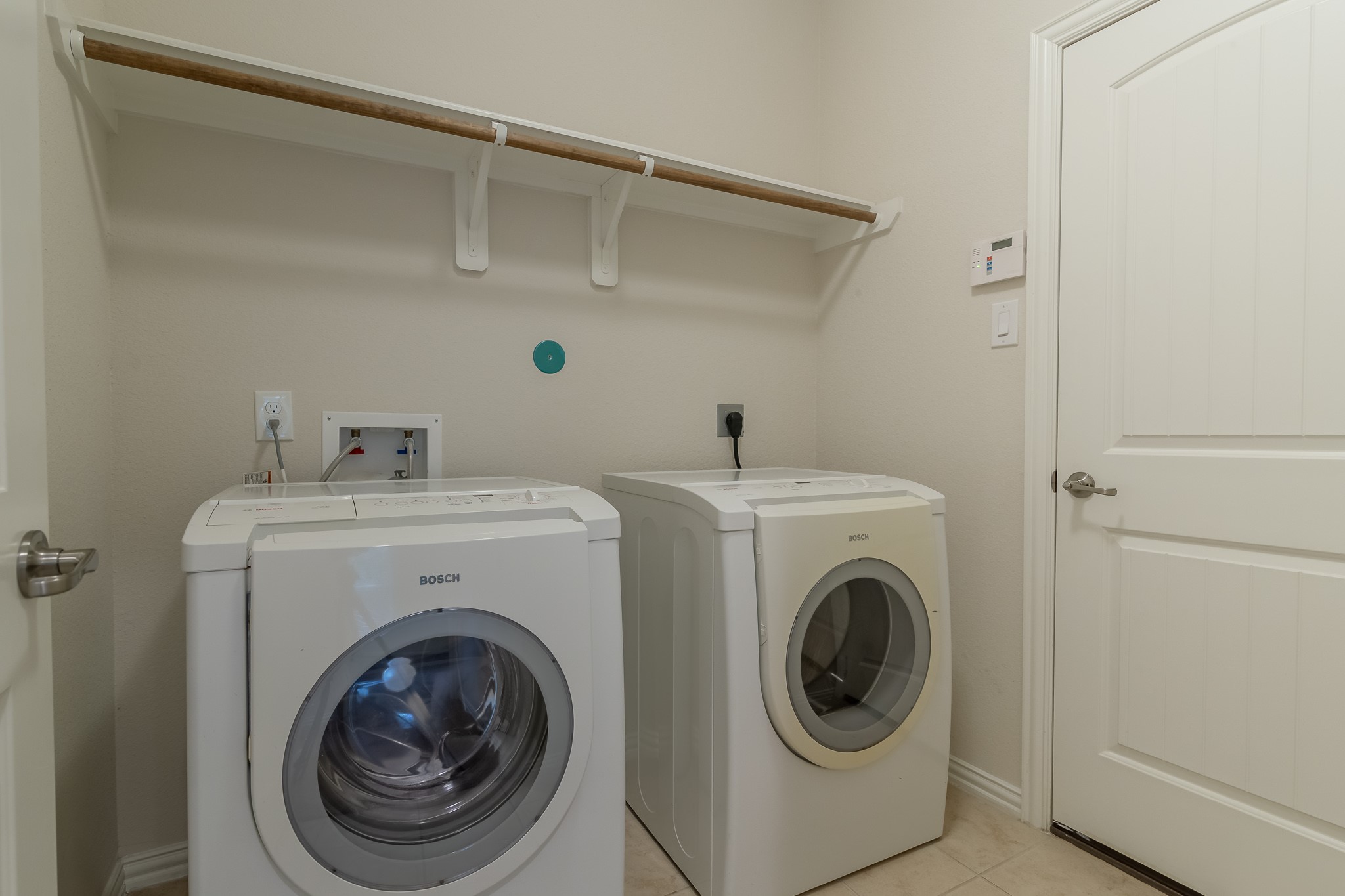 5 Iris Arbor Court Conroe, TX 77301 - Photo 35 of 35 a utility room with dryer and washer
