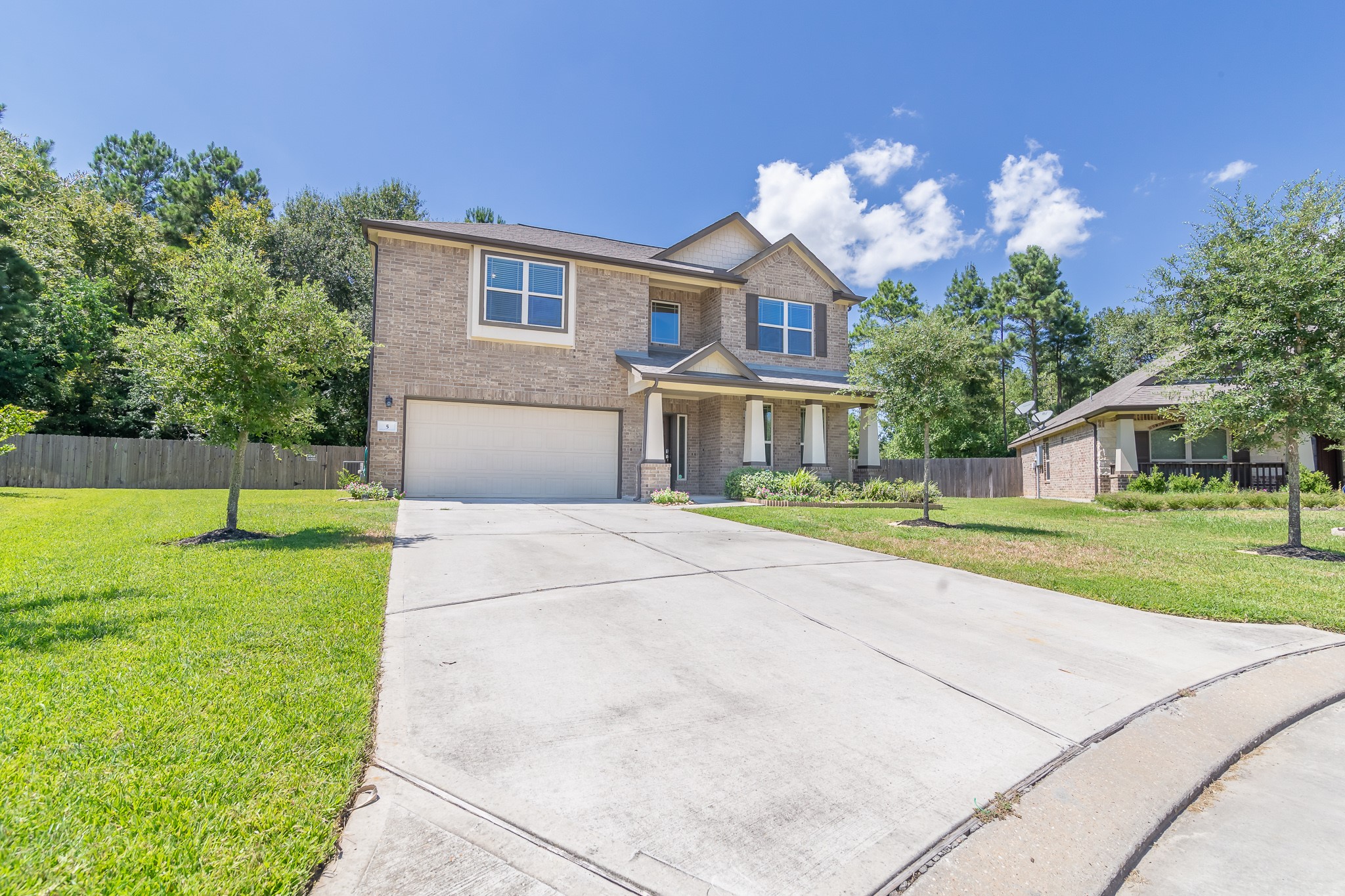 5 Iris Arbor Court Conroe, TX 77301 - Photo 5 of 35 a front view of a house with garden