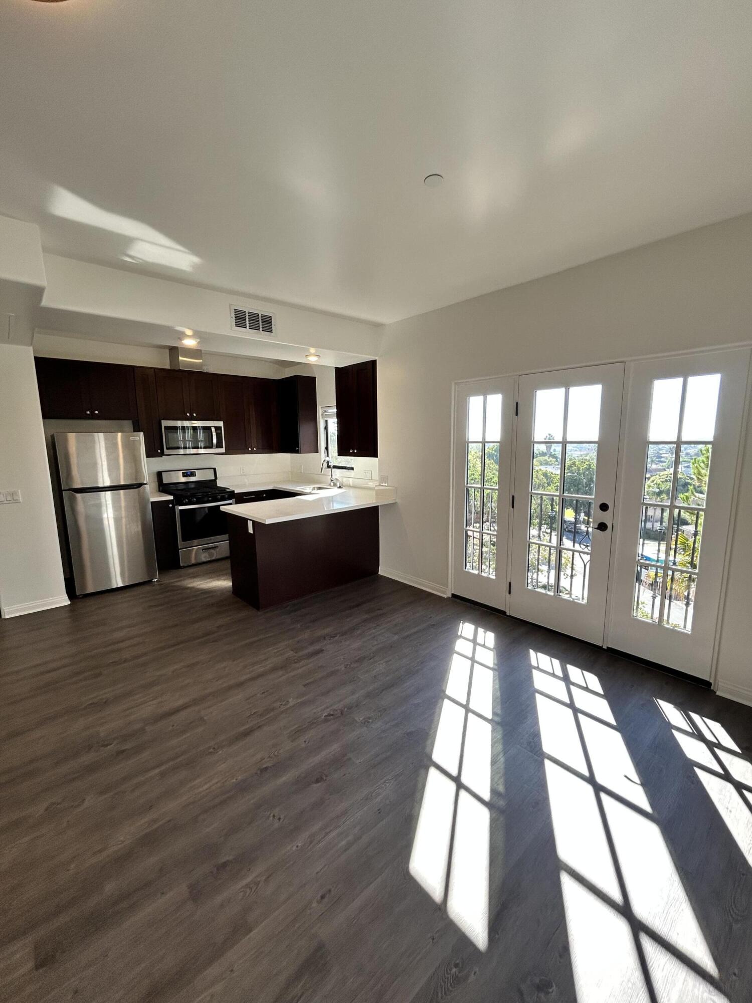 920 Lowena Drive, Unit 9 Santa Barbara, CA 93103 - Photo 7 of 10 a kitchen with stainless steel appliances granite countertop a stove and cabinets