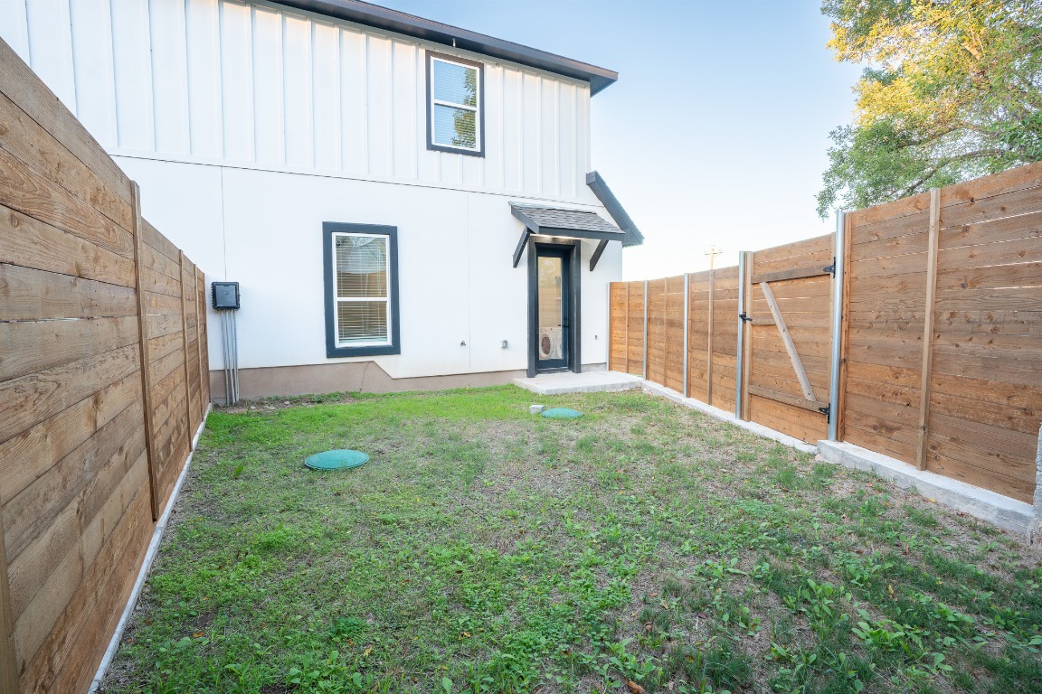 162 Meadow View Boulevard, Unit A Del Valle, TX 78617 - Photo 16 of 30 a view of a house with a yard and pathway