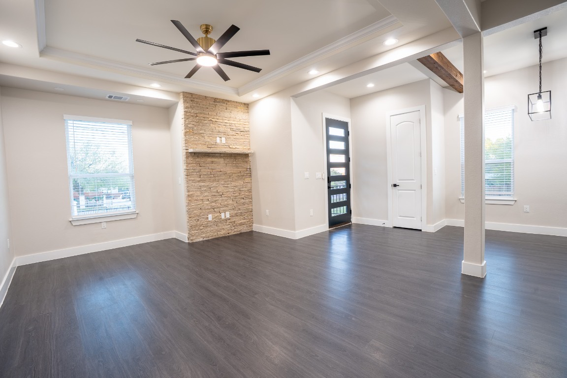 162 Meadow View Boulevard, Unit A Del Valle, TX 78617 - Photo 2 of 30 a view of an empty room with window and wooden floor