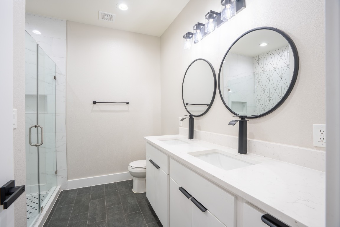 162 Meadow View Boulevard, Unit A Del Valle, TX 78617 - Photo 23 of 30 a bathroom with a sink and a mirror