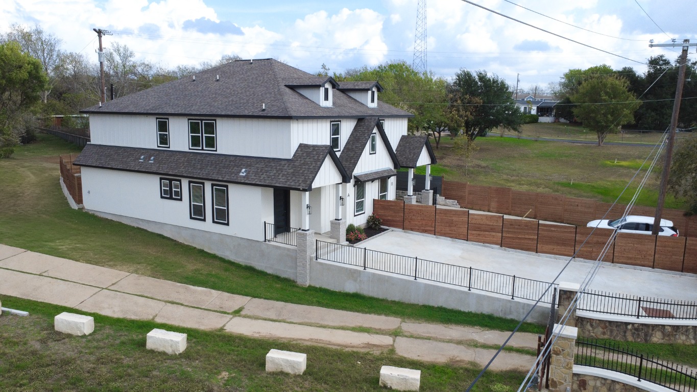 162 Meadow View Boulevard, Unit A Del Valle, TX 78617 - Photo 29 of 30 a front view of a house with garden