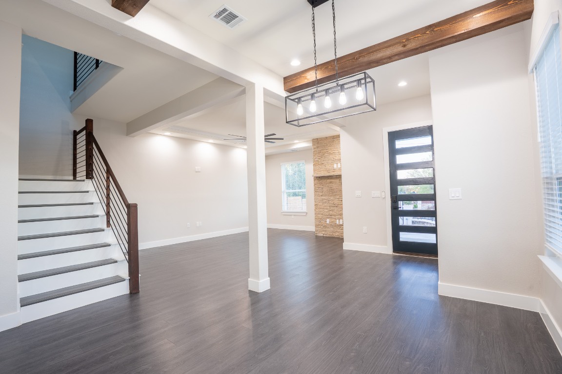 162 Meadow View Boulevard, Unit A Del Valle, TX 78617 - Photo 5 of 30 a view of a hallway with wooden floor and entryway