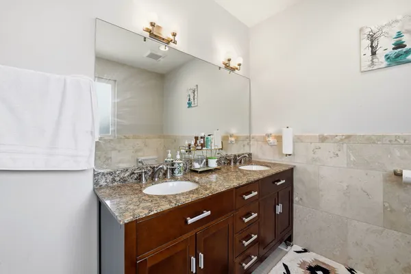 a bathroom with a bathtub a toilet and a shower