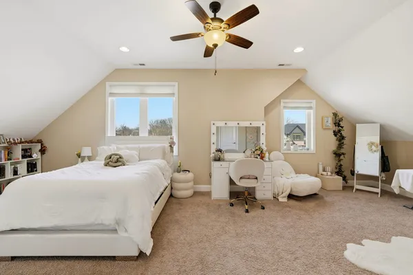 a bathroom with a bathtub sink mirror and toilet