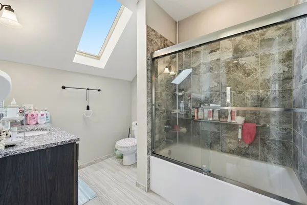 a living room with furniture rug and wooden floor