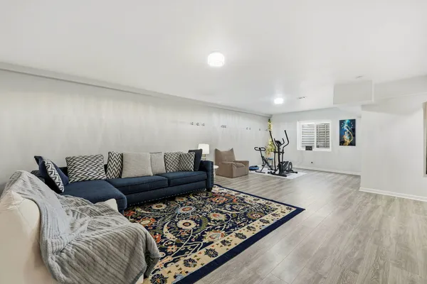 a view of a kitchen with a sink and a refrigerator