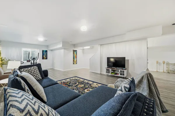 a kitchen with a refrigerator and white cabinets