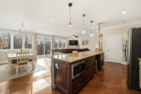 a kitchen with stainless steel appliances granite countertop a stove and a refrigerator