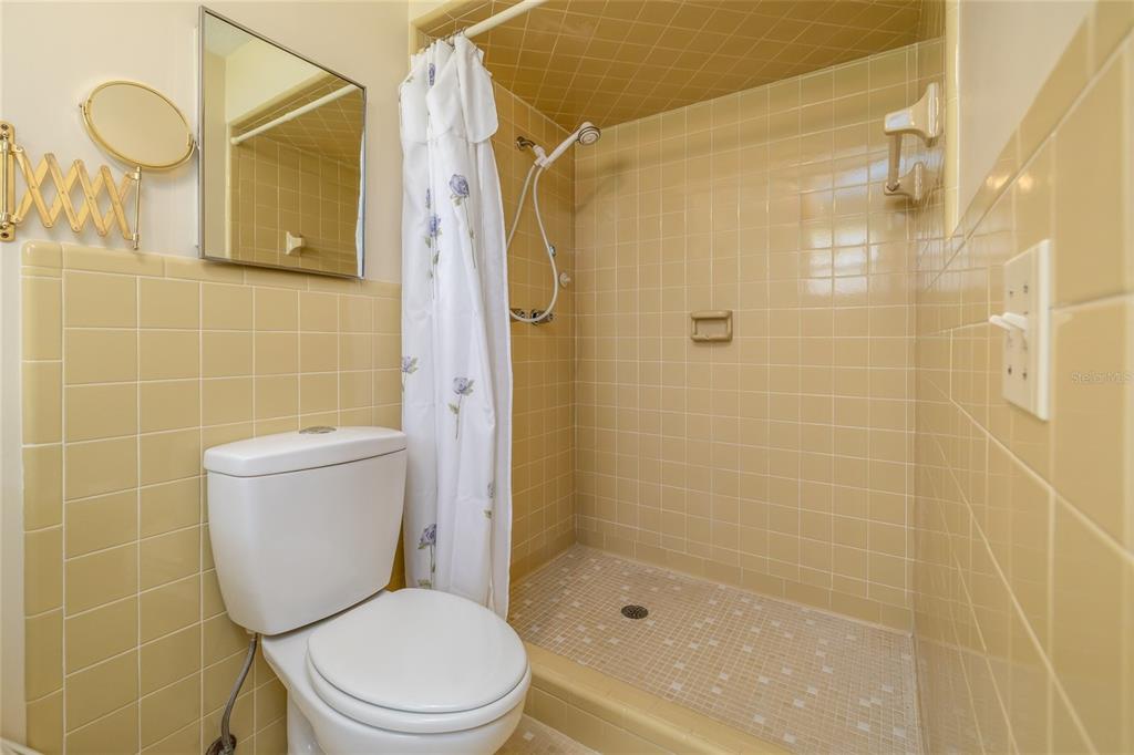 901 Duncan Road South Daytona, FL 32119 - Photo 13 of 22 a bathroom with a toilet and shower