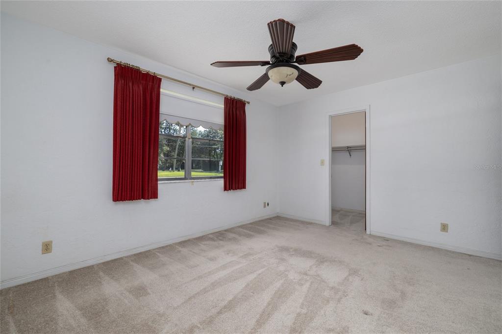 901 Duncan Road South Daytona, FL 32119 - Photo 14 of 22 a view of an empty room with a ceiling fan